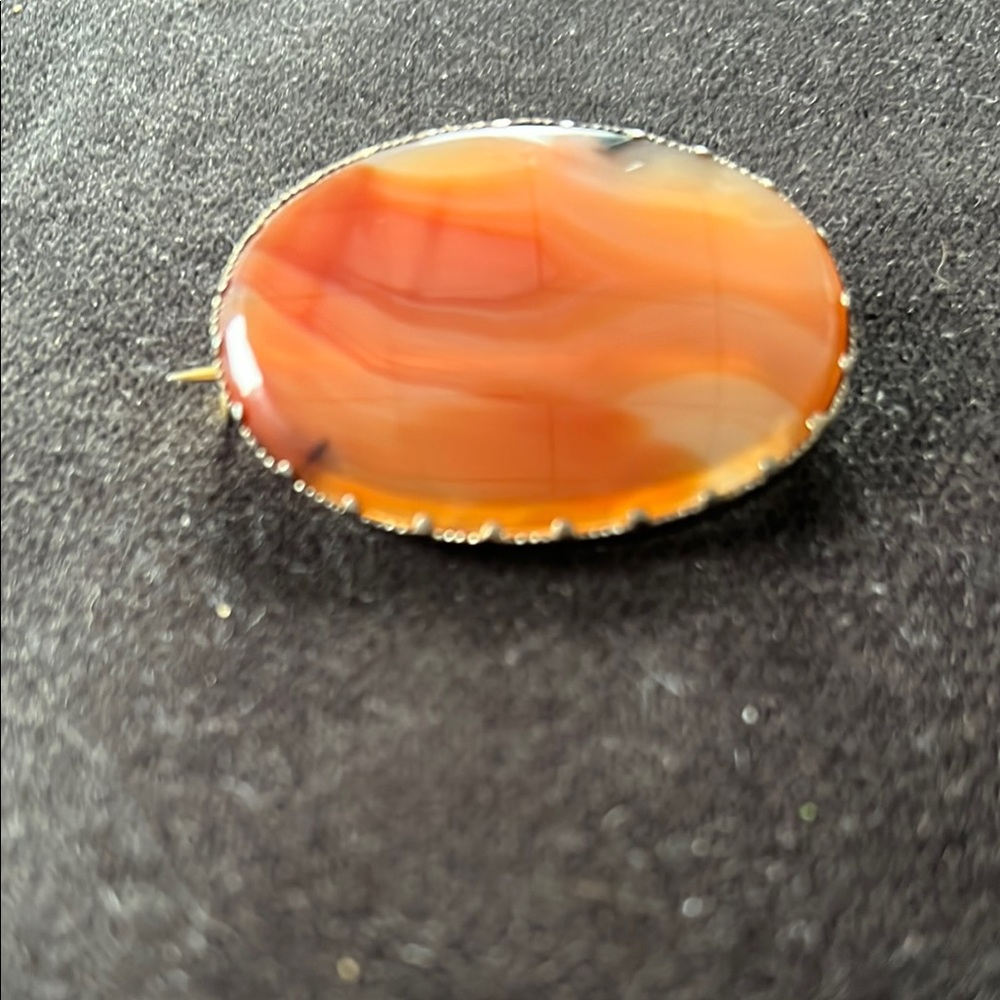 Amber Brooch with Scalloped Silver Setting
